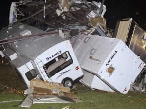 Travel trailers and motor homes were piled on top of each other at Mayflower RV in Mayflower, Ark., on Sunday after tornadoes carved through the central and southern U.S.