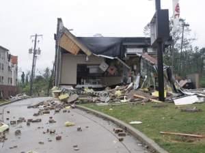 A motel and restaurant show significant damage from a tornado that ripped through Tupelo, Miss., on Monday.