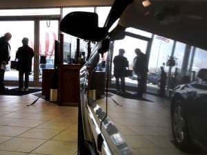 A car salesman speaks with a customer at the Apple Chevrolet dealership in Orland Park, Ill., Saturday, Feb. 28, 2009. Automakers report U.S. sales for February on Tuesday.