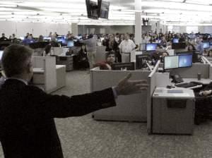 Peter Lee (left), executive director of Covered California, greets employees at a call center in Fresno, Calif., in February.