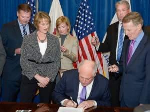 Gov. Pat Quinn signs the pension overhaul, known sometimes as Senate Bill 1, into law in December, 2013.