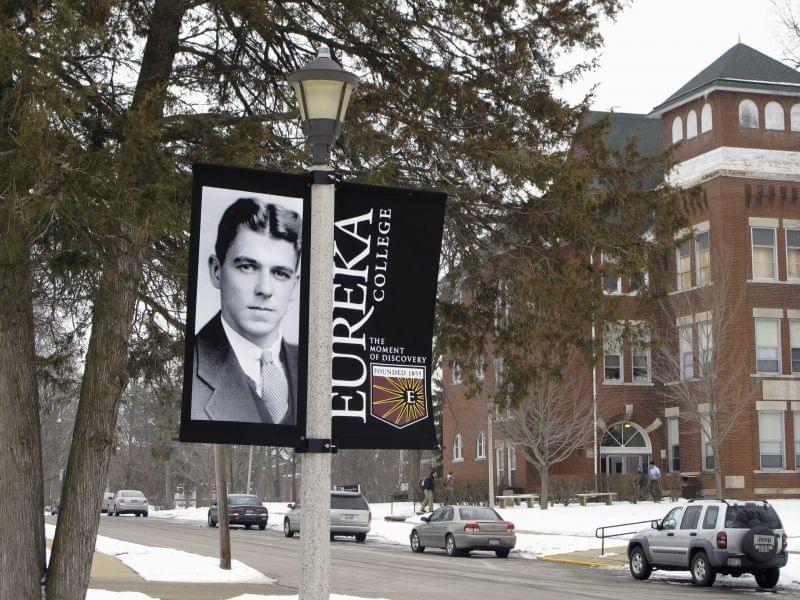 In this photo taken Jan. 25, 2011, a banner noting the centennial of Ronald Reagan's birth hangs on the campus of his alma mater, Eureka College in Eureka, Ill.