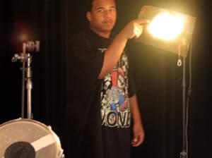 Nick adjusting studio lights before an interview