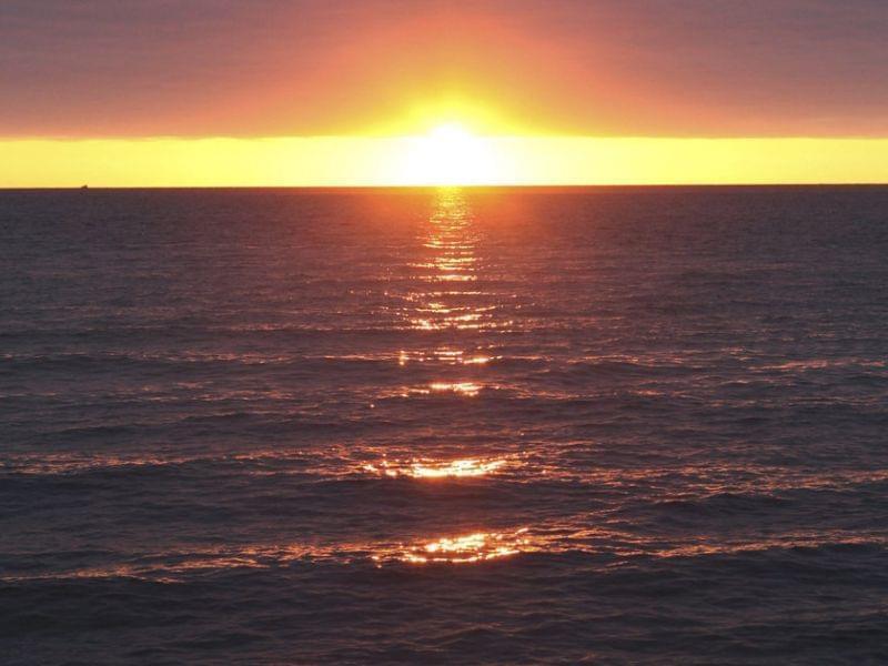 The Department of the Interior is proposing a large expansion of U.S. efforts to make energy from offshore winds, with a plan centered off the Massachusetts coast. Here, a 2010 photo shows a sunrise over Nantucket Sound.