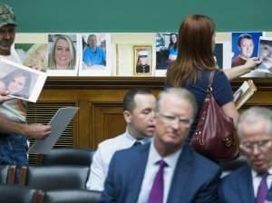 Family members of victims of a faulty GM ignition switch lined the rear wall of a congressional hearing with their photos Wednesday.