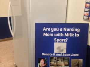 A sign is displayed in front of the freezer at the Champaign-Urbana Public Health District, where breast milk will be stored.