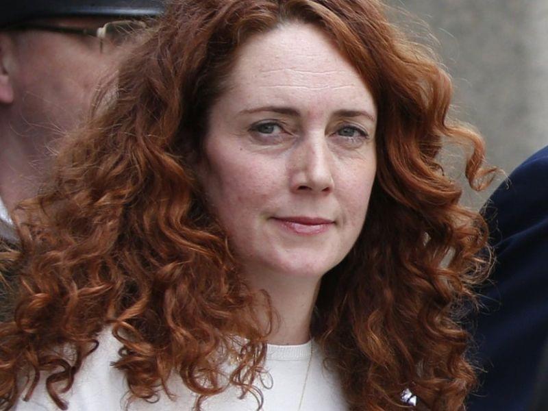Rebekah Brooks, former News International chief executive, leaves the Central Criminal Court in London Tuesday, after being acquitted. Former News of the World editor Andy Coulson was convicted of phone hacking Tuesday.