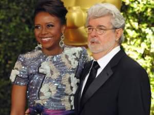 In this Nov. 16, 2013 file photo, filmmaker George Lucas and his wife, Chicago native Mellody Hobson, are seen on the red carpet at the 2013 Governors Awards in Los Angeles.