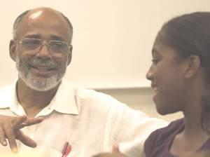 Leon Dash, Swanlund Professor of Journalism at Illinois, and Franklin Middle School student Isis Griffin