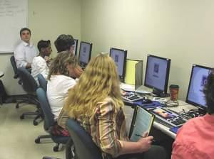 Youth Media Workshop teachers practice with sound editing software 