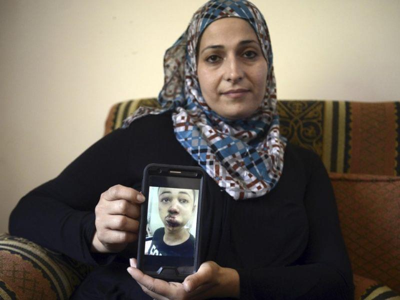 Suha Abu Khdeir holds picture of her son, Tariq Abu Khdeir, a U.S. citizen.