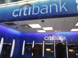 In this Jan. 6, 2012 photo, a Citibank customer makes a transaction at an ATM, in New York. 