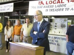 Democratic Lt. Gov. candidate Paul Vallas calls on GOP gov. candidate Bruce Rauner to release his full tax returns during a news conference in Savoy, IL.