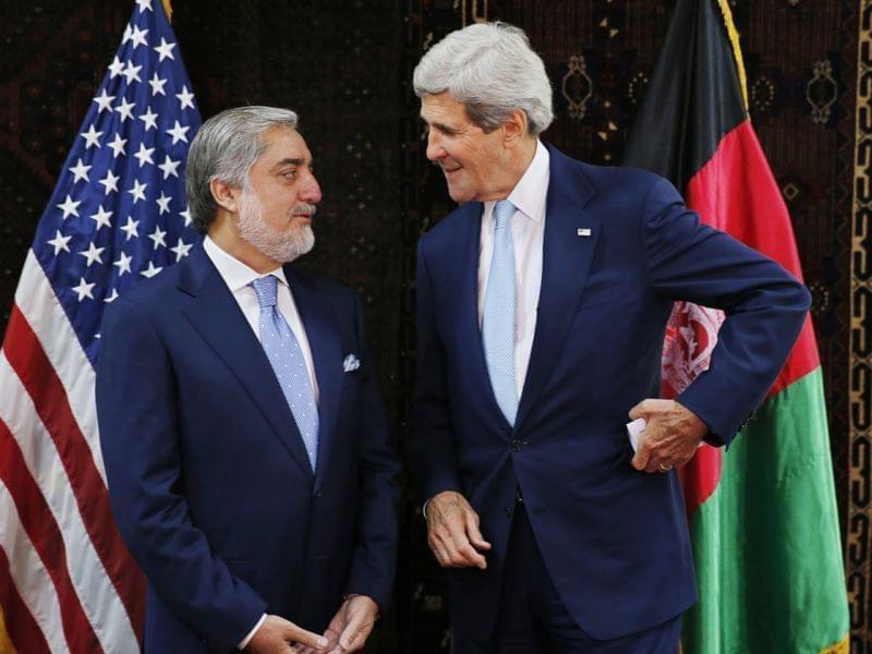 U.S. Secretary of State John Kerry talks with Afghan presidential candidate Abdullah Abdullah at the start of a meeting at the U.S. Embassy in Kabul on Friday. Kerry sought Friday to broker a deal between Afghanistan's rival presidential candida