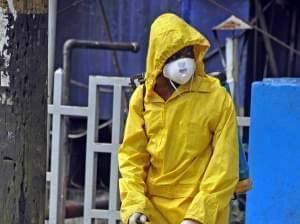 Monrovia City Corporation employee sprays disinfectant 
