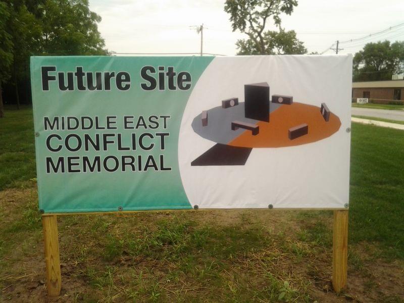 A sign posted on a vacant lot in Danville announces the future site of the Middle East Conflicts Veterans Memorial, including an artist's depiction of the design.