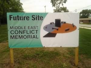 A sign posted on a vacant lot in Danville announces the future site of the Middle East Conflicts Veterans Memorial, including an artist's depiction of the design.