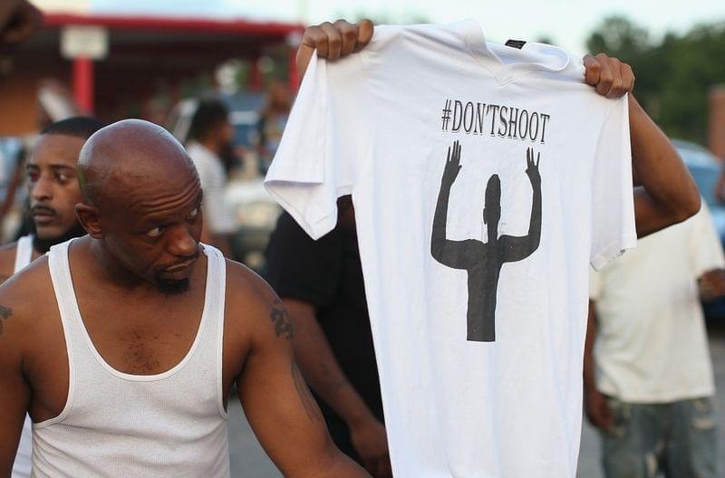 Demonstrators protest killing of Michael Brown, 18, in Ferguson, MO.