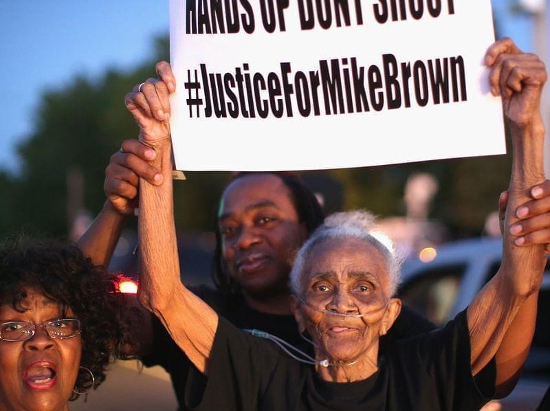 Creola McCalister protests the killing of teenager Michal Brown Tuesday.