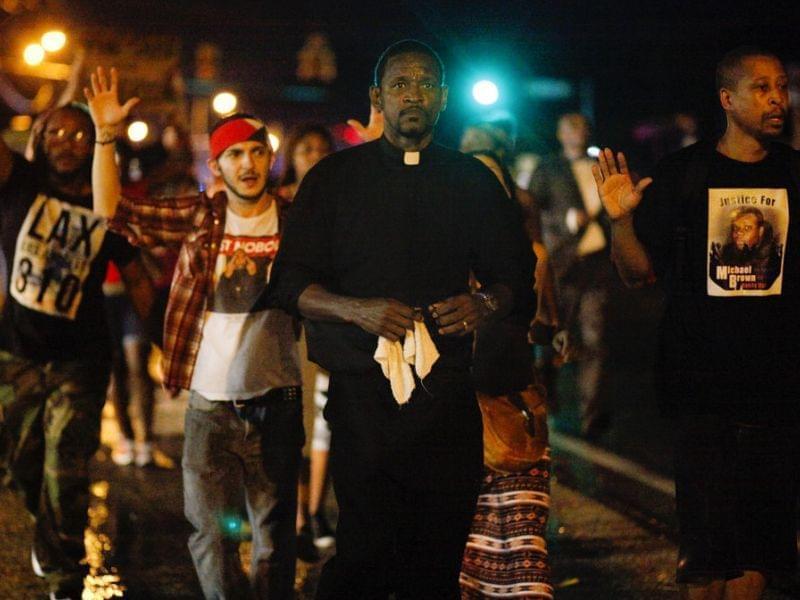 Clergyman leads demonstrators in Ferguson, Mo.