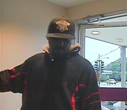 Photo captured by security camera of suspect in the robbery at First Midwest Bank at Prospect and Springfield in Champaign.