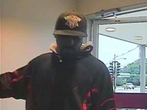 Photo captured by security camera of suspect in the robbery at First Midwest Bank at Prospect and Springfield in Champaign.