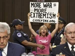 Members of protest group CodePink interrupt a Senate Armed Services Committee hearing