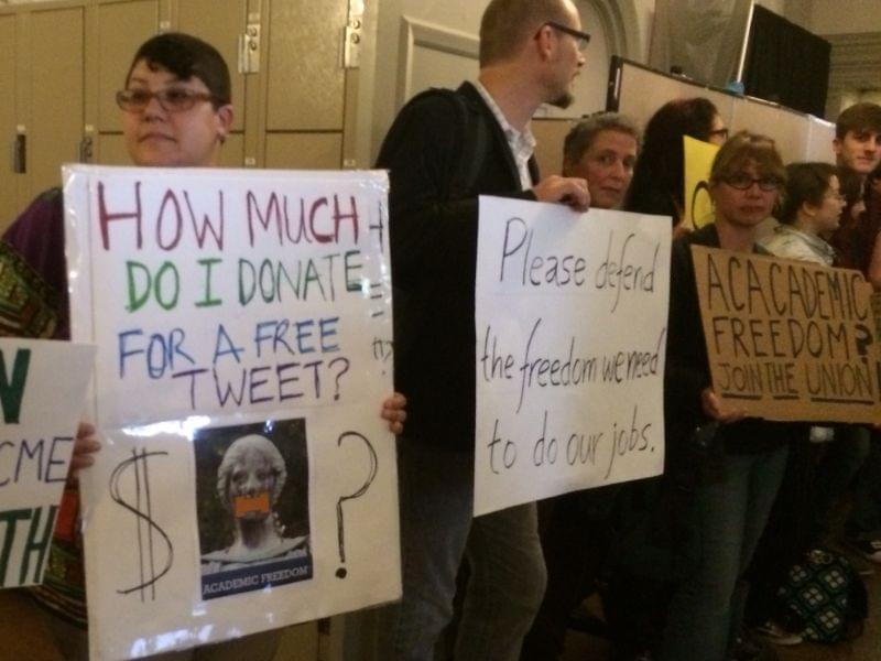 Supporters of Steven Salaita hold signs and chant outside the Academic Senate meeting on Monday.