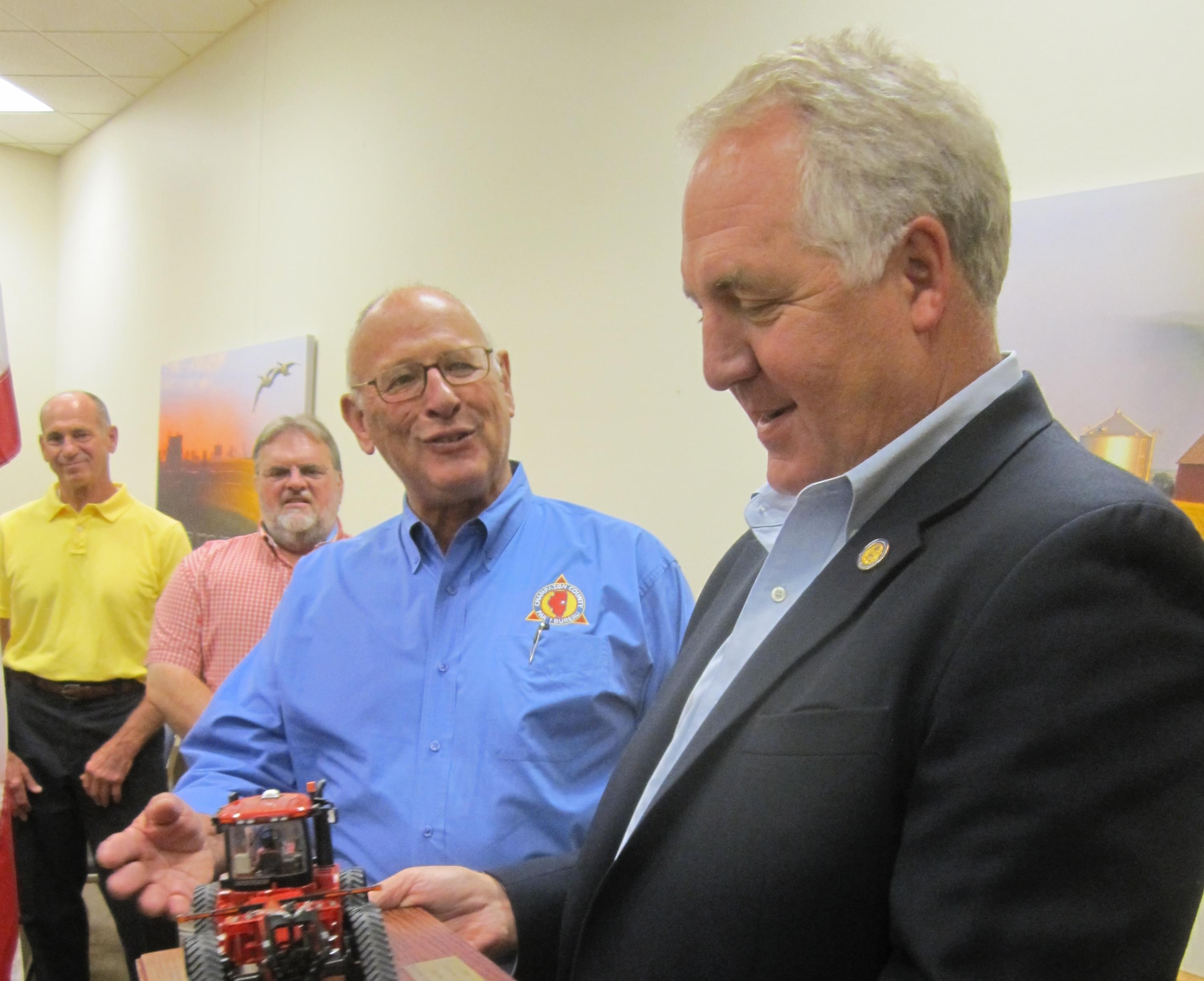 Congressman John Shimkus holds his ACTIVATOR Friend of Agriculture Award.