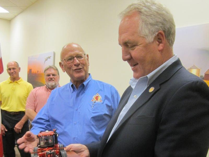 Congressman John Shimkus holds his ACTIVATOR Friend of Agriculture Award.