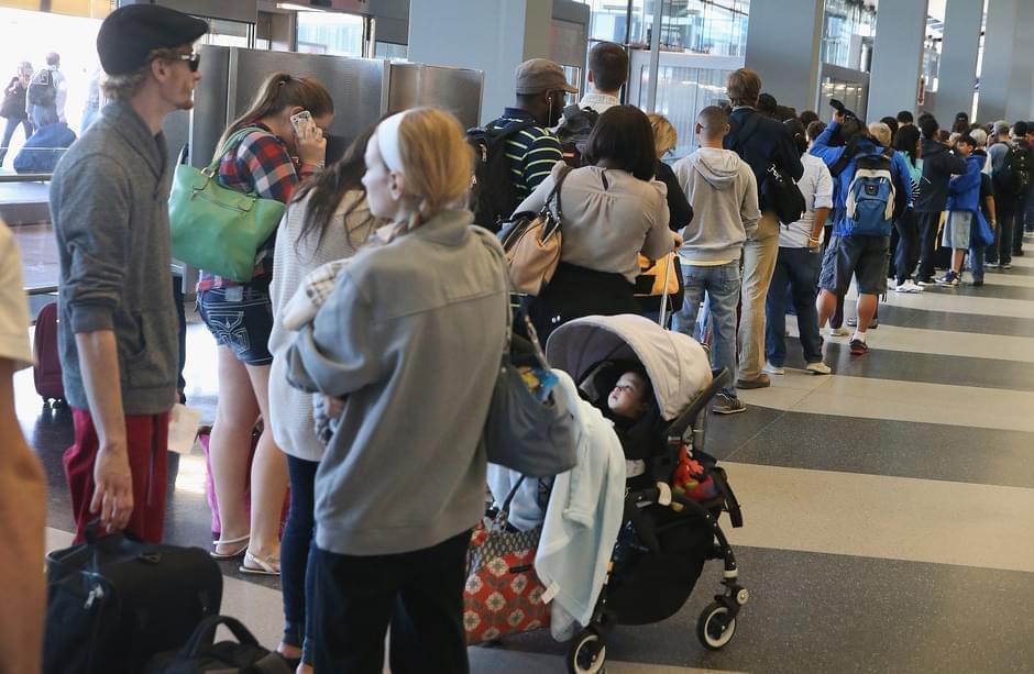 Travelers lined up Friday at O'Hare International Airport.