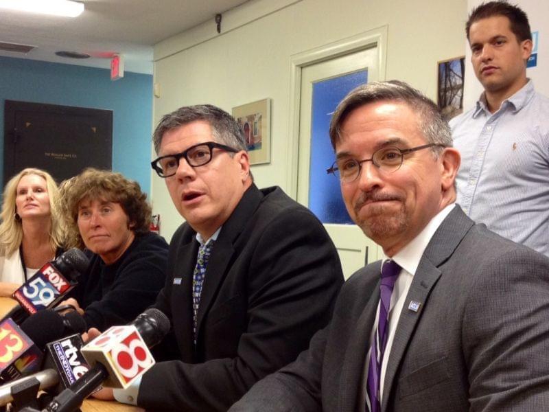 Same-sex couples involved in the lawsuit in Indiana appear at a news conference.