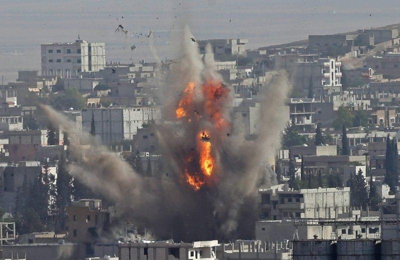 Smoke rises after a US coalition airstrike in the city of Kobani Monday.