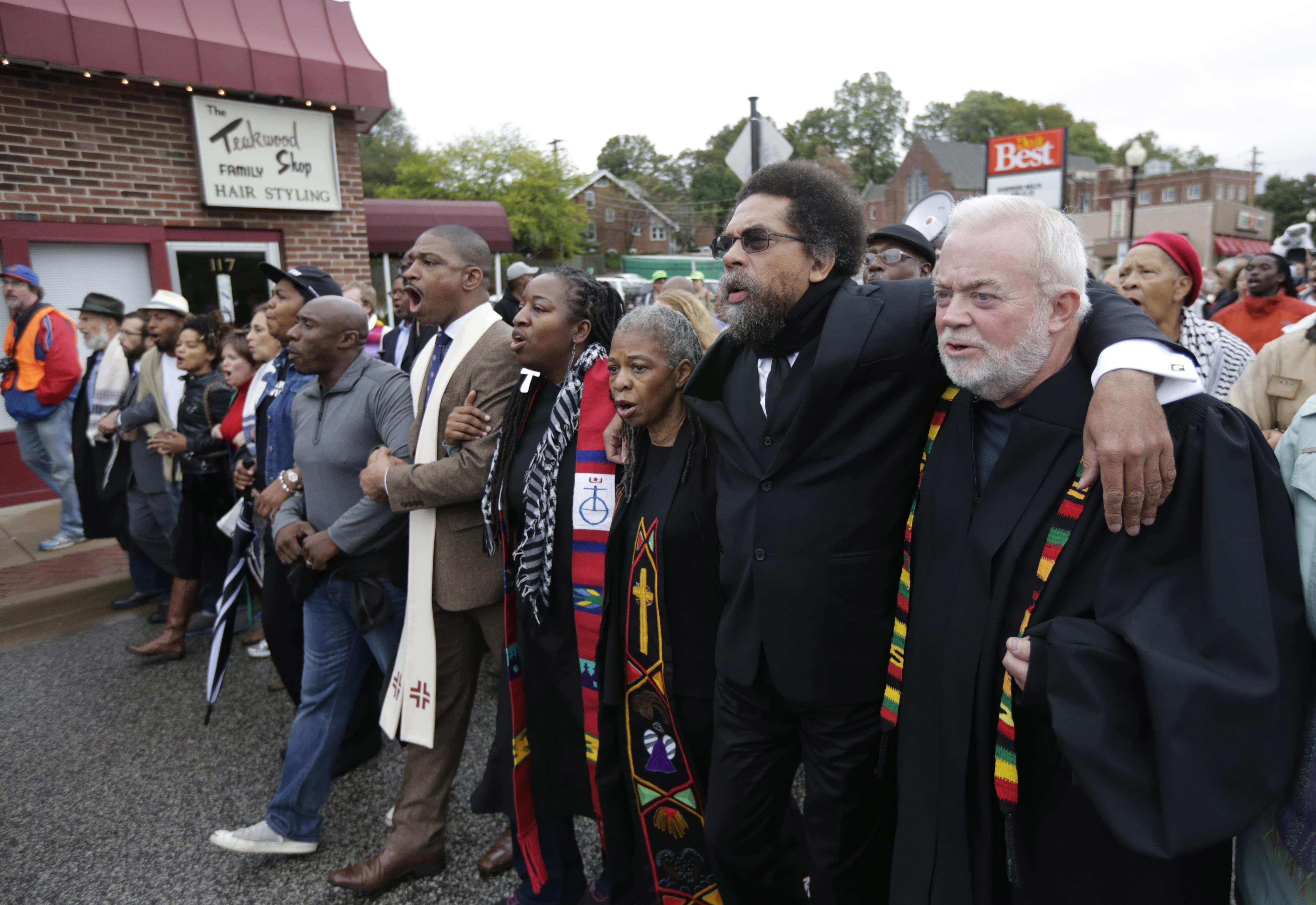 Protesters march to the Ferguson Police Station October 13.
