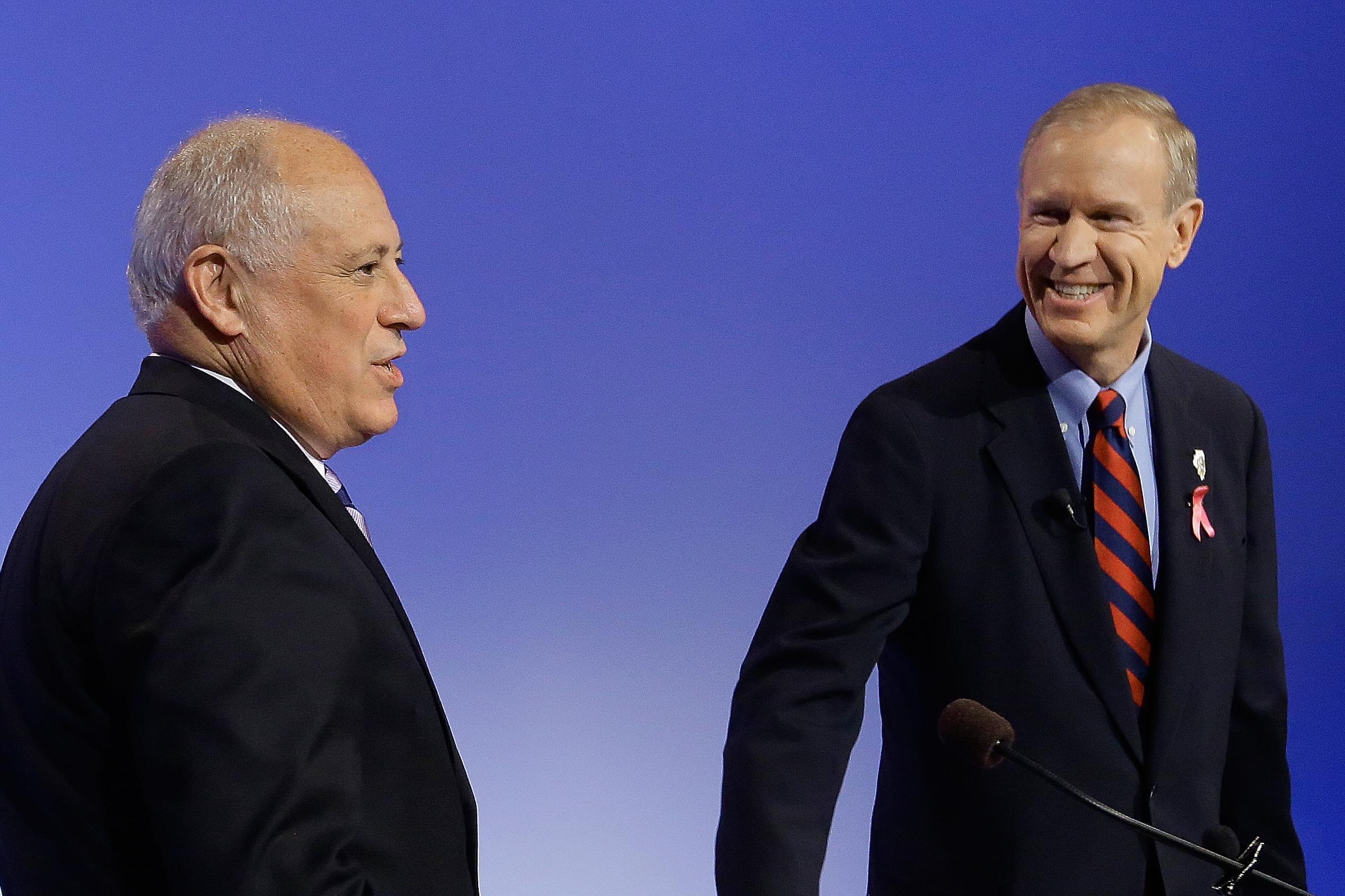 Governor Pat Quinn prepares to debate challenger Bruce Rauner.