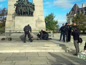 A Canadian soldier shot outside the war memorial in Ottawa is tended to Wednesday.
