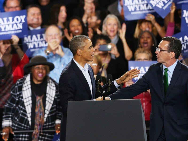 President Obama stands with Connecticut Governor Dan Malloy in Bridgeport Sunday. 