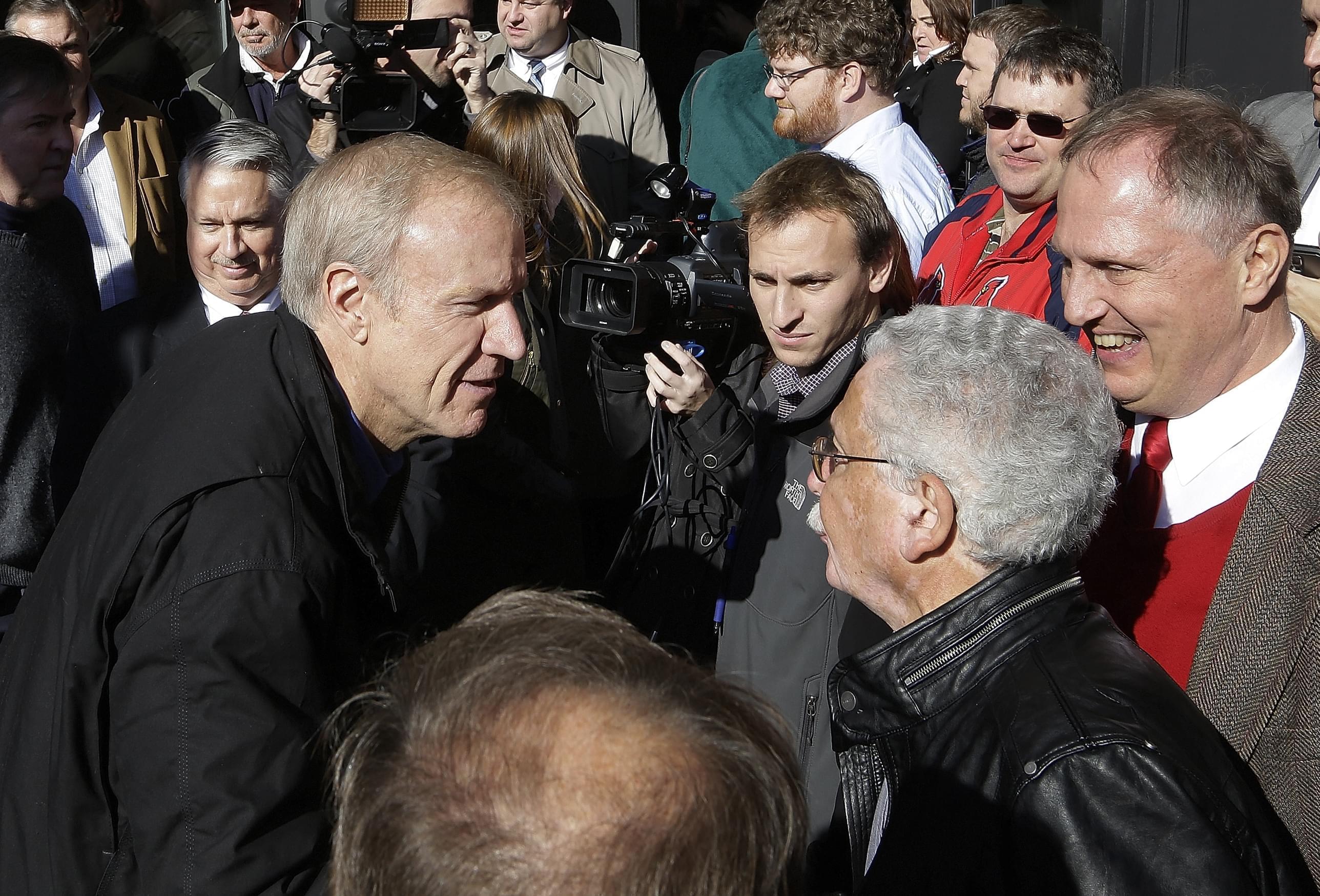 Gov.-elect Bruce Rauner greets supporters in Springfield, Ill.