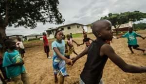 Children play in an open space in Barkedu, Liberia.