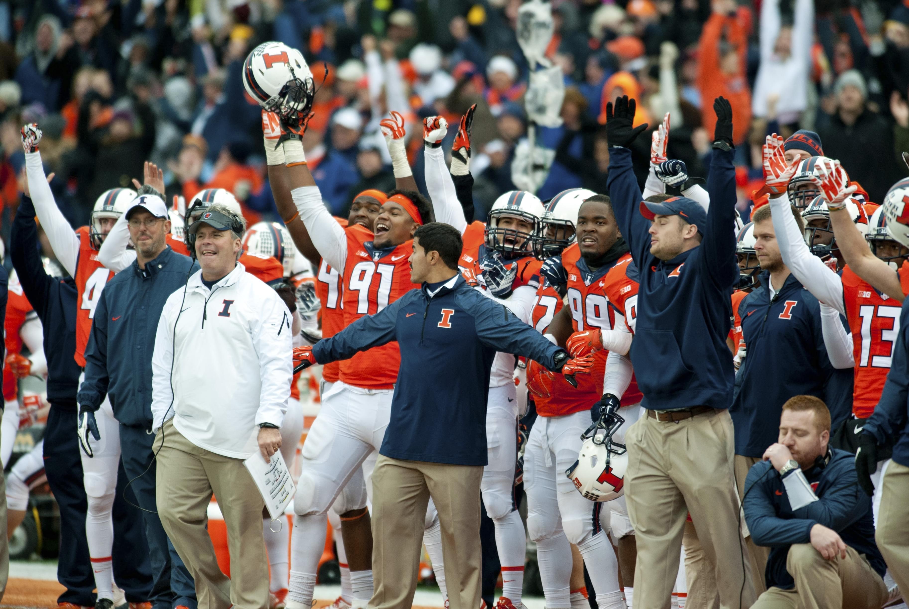 Illinois sideline reacts after David Reisner's game-winning field goal Saturday to defeat Penn State 16 to 14.