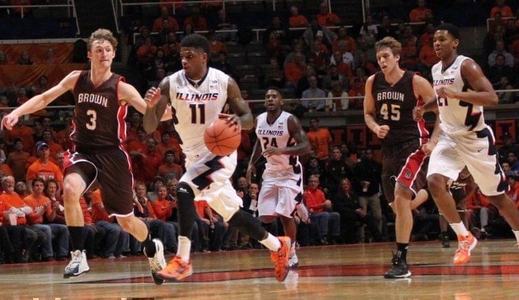 Aaron Cosby dribbles down court against Brown Monday at the State Farm Center.