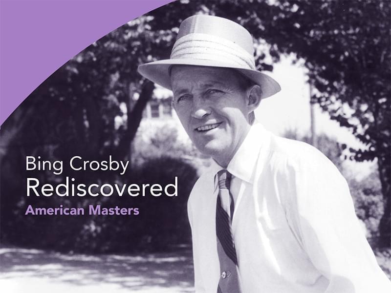 Photo of Bing Crosby wearing a straw hat