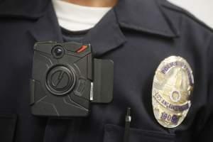 A Los Angeles Police officer wears an on-body camera during a demonstration for media.