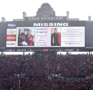 A police poster showing Kosta Karageorge is displayed on the large video board before the state of Ohio State's game Saturday.