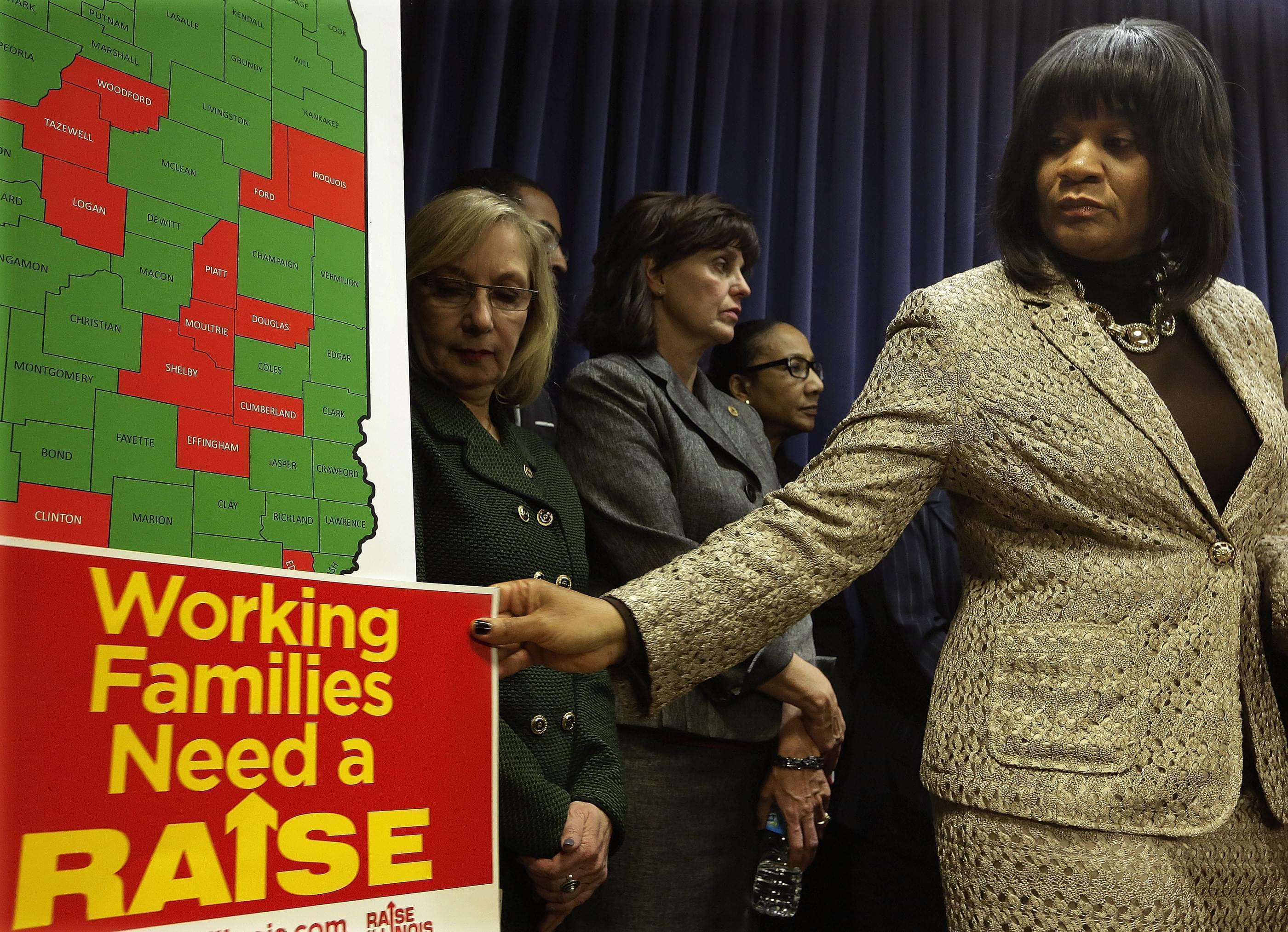 Senator Kimberly Lightford prepares to speak with reporters about raising the minimum wage on November 19th.