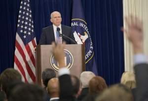 CIA Director John Brennan takes questions during a news conference at agency headquarters.