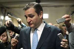 Sen. Ted Cruz talks with reporters on Capitol Hill Friday as the Senate considers a spending bill.