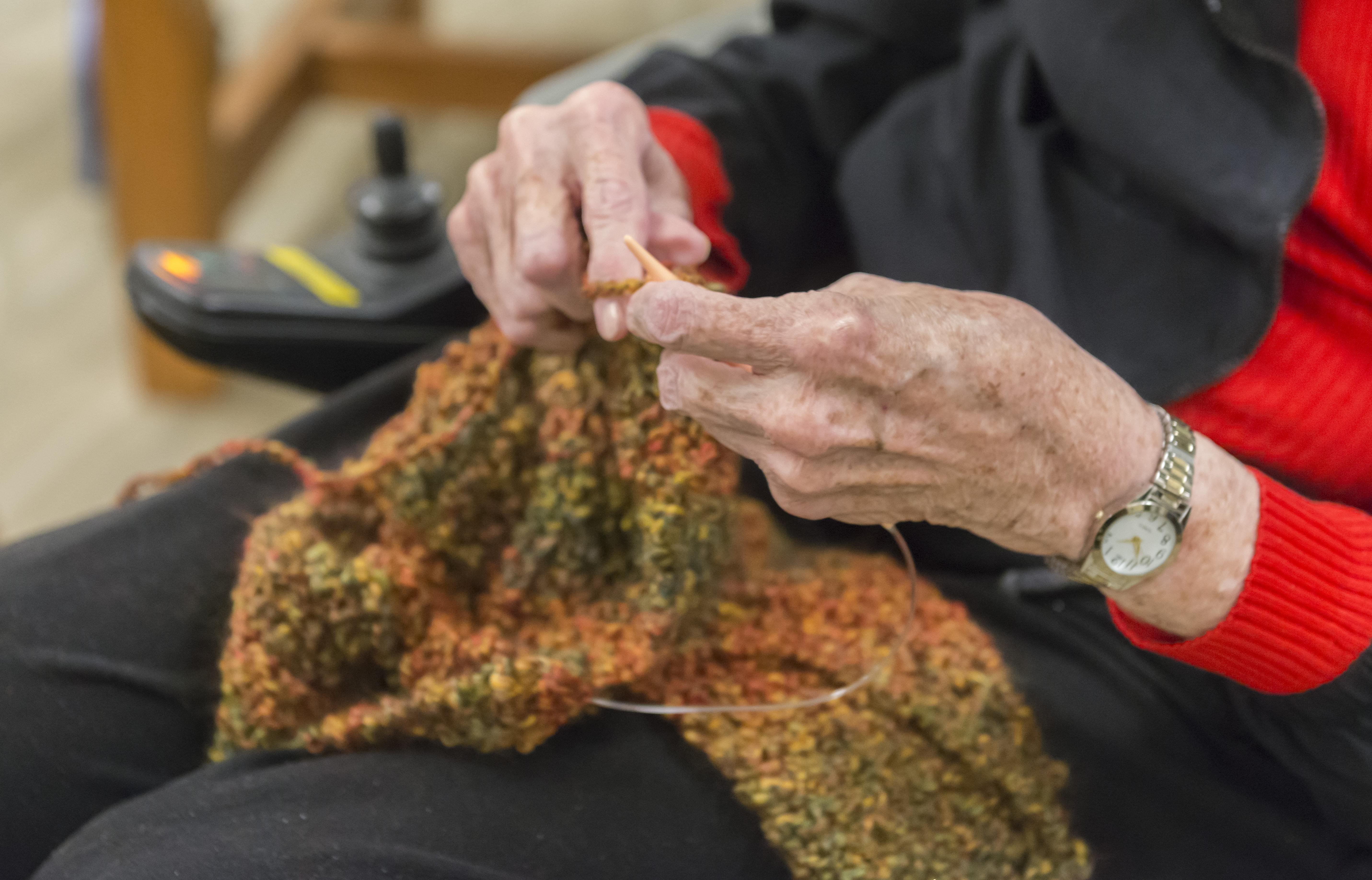 a resident in a nursing home knitting