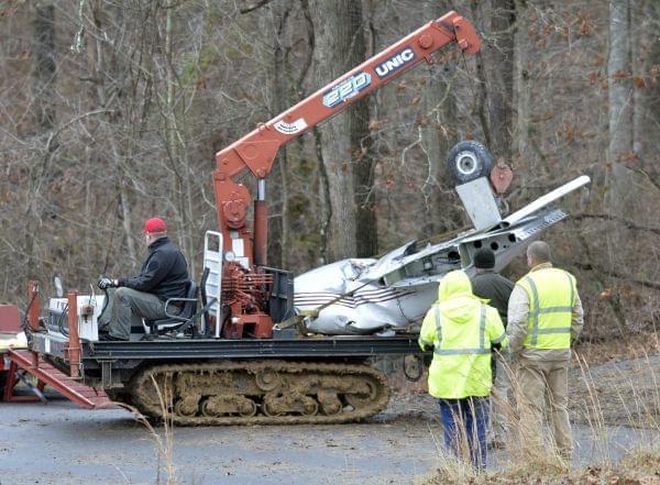 Salvage workers clearing site of plane crash