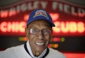 In a March 2014 file photo, Ernie Banks smiles after an interview at the Cubs offices in Chicago.